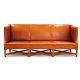 Kaare Klint three seater sofa 4118 with patinated natural leather. Very nice 
condition. L: 199cm. H: 82cm. D: 80cm